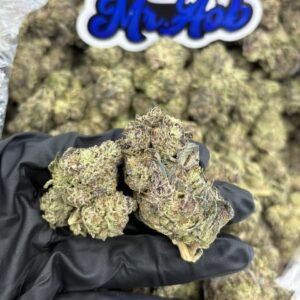 Buy Crunch Berries strain online — authentic Exotic Genetix indica hybrid with forest green and purple buds from NTTD Mr. Aob